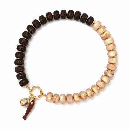 A beaded stretch bracelet featuring dark brown wooden beads on one side and light beige stone beads on the other, finished with a gold-tone clasp and a small charm.