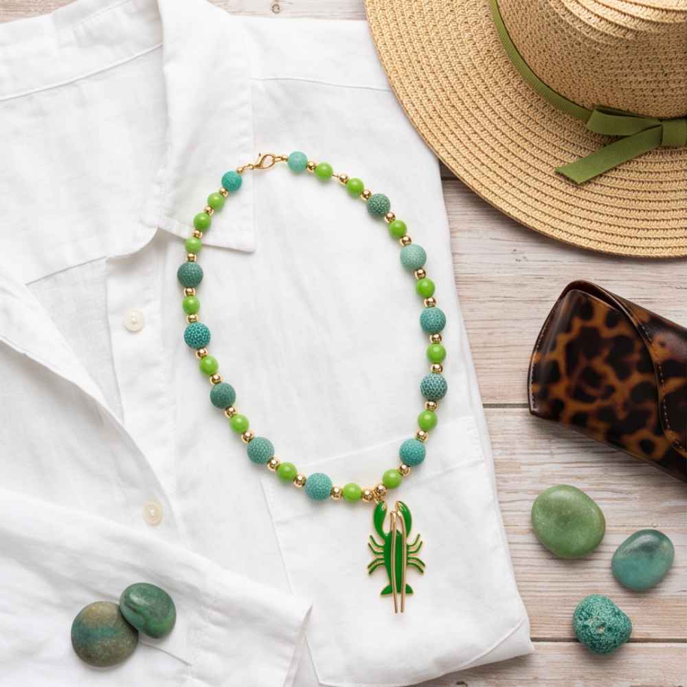 Green natural agate and acrylic bead necklace with gold-tone accents and enamel lobster pendant