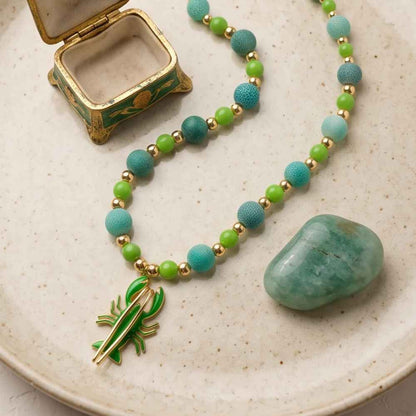 Marina handmade necklace with natural matte green agate beads and 18K gold-plated enamel lobster pendant