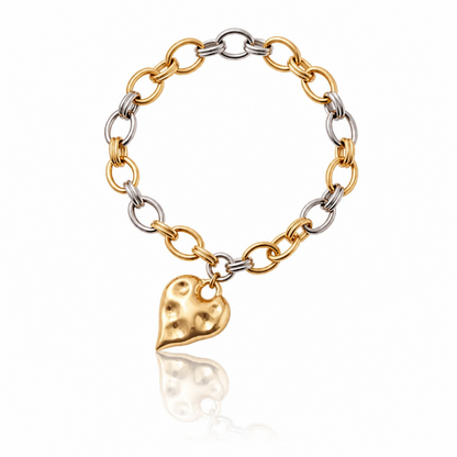 Two-tone 18K gold-plated bracelet with textured heart charm from the Modern Relics Collection by Julie Saldivia
