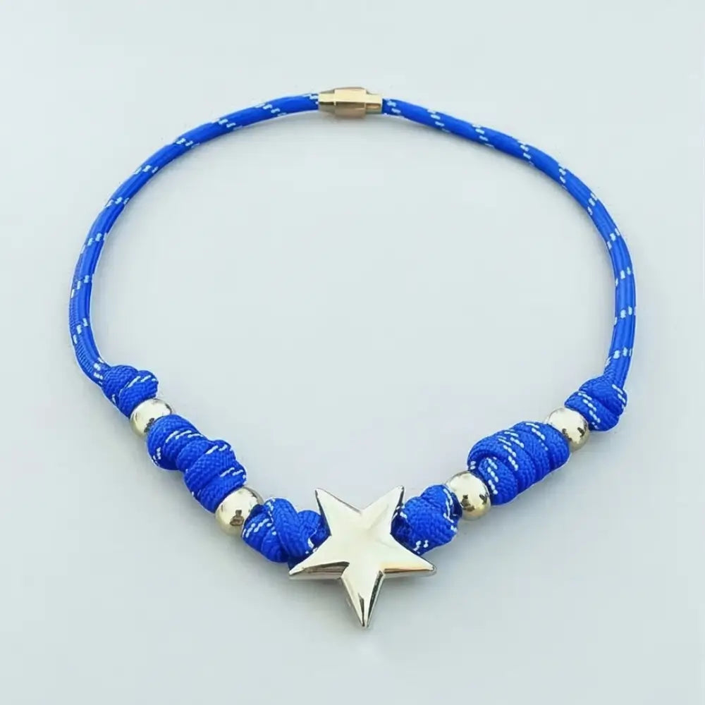 Blue beaded necklace with a star pendant on a light gray background