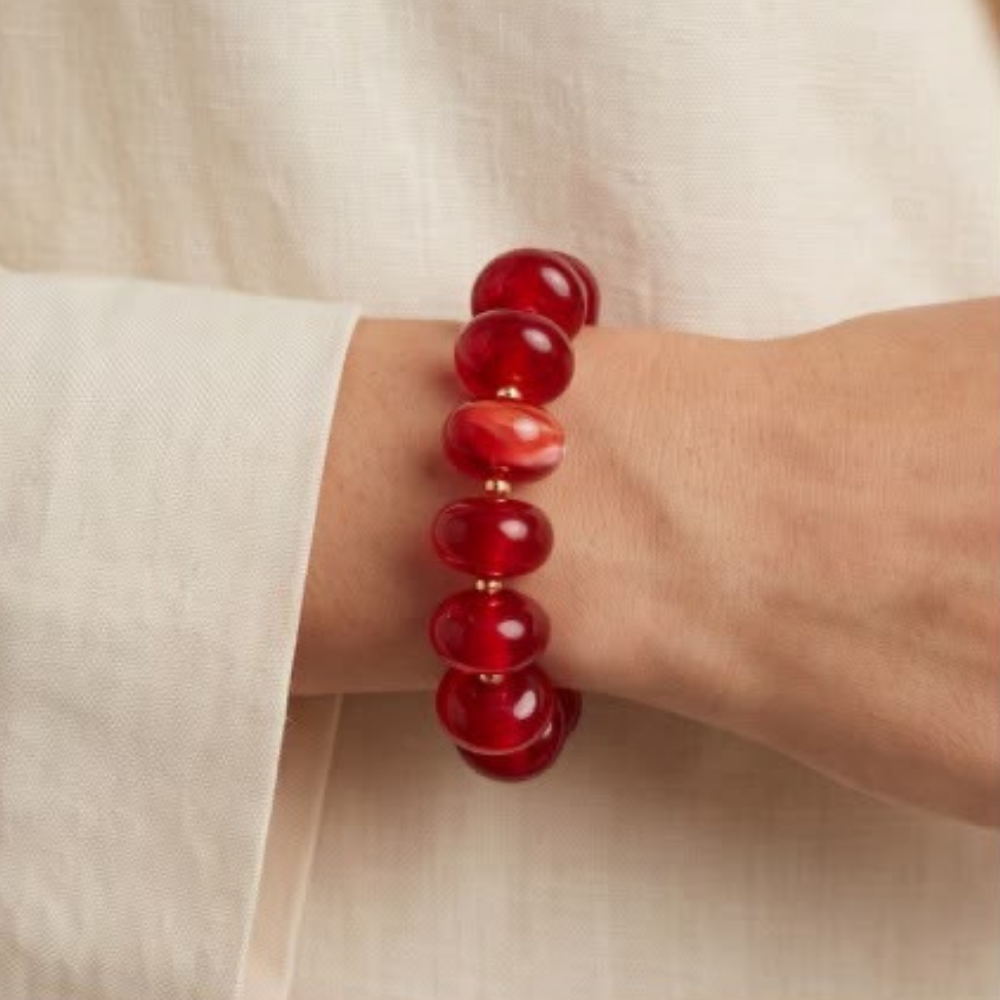 Woman wearing the Rouge red acrylic bead bracelet from Julie Saldivia Modern Relics