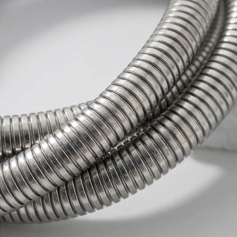 close up silver coil bracelet textured flexible metal wrap bracelet modern statement jewelry