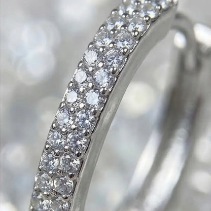 close up silver hoop earrings with cubic zirconia pave detail sparkling elegant jewelry