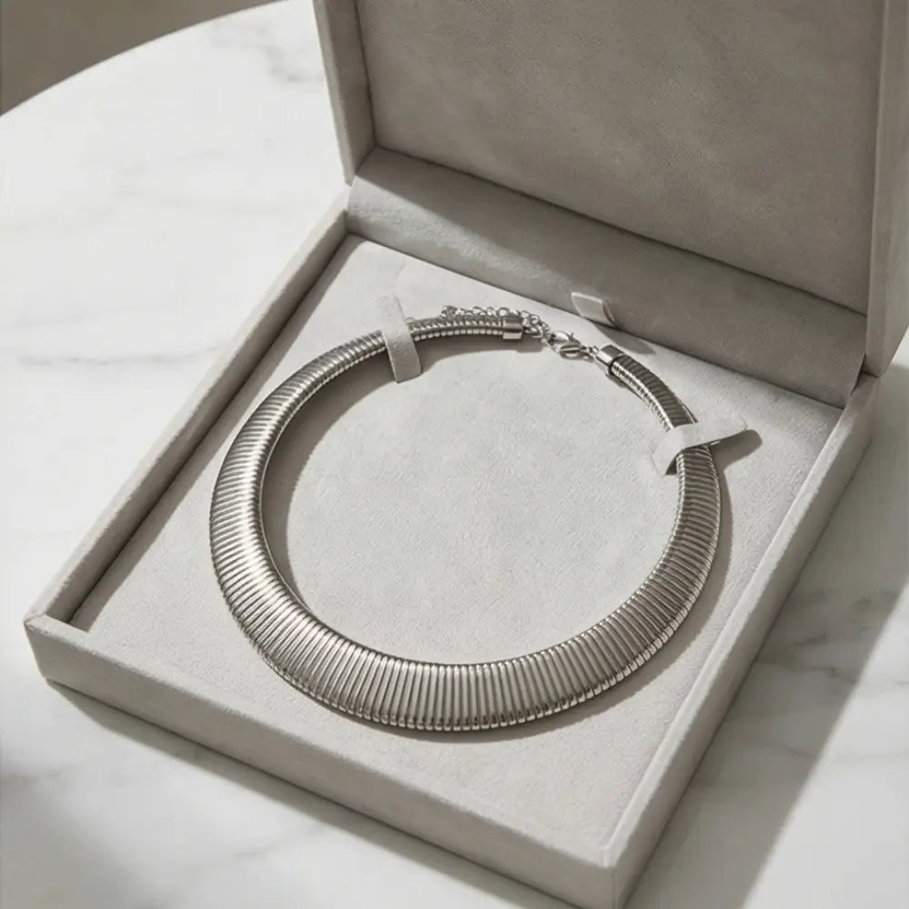 silver statement necklace in luxury jewelry box minimalist stainless steel design