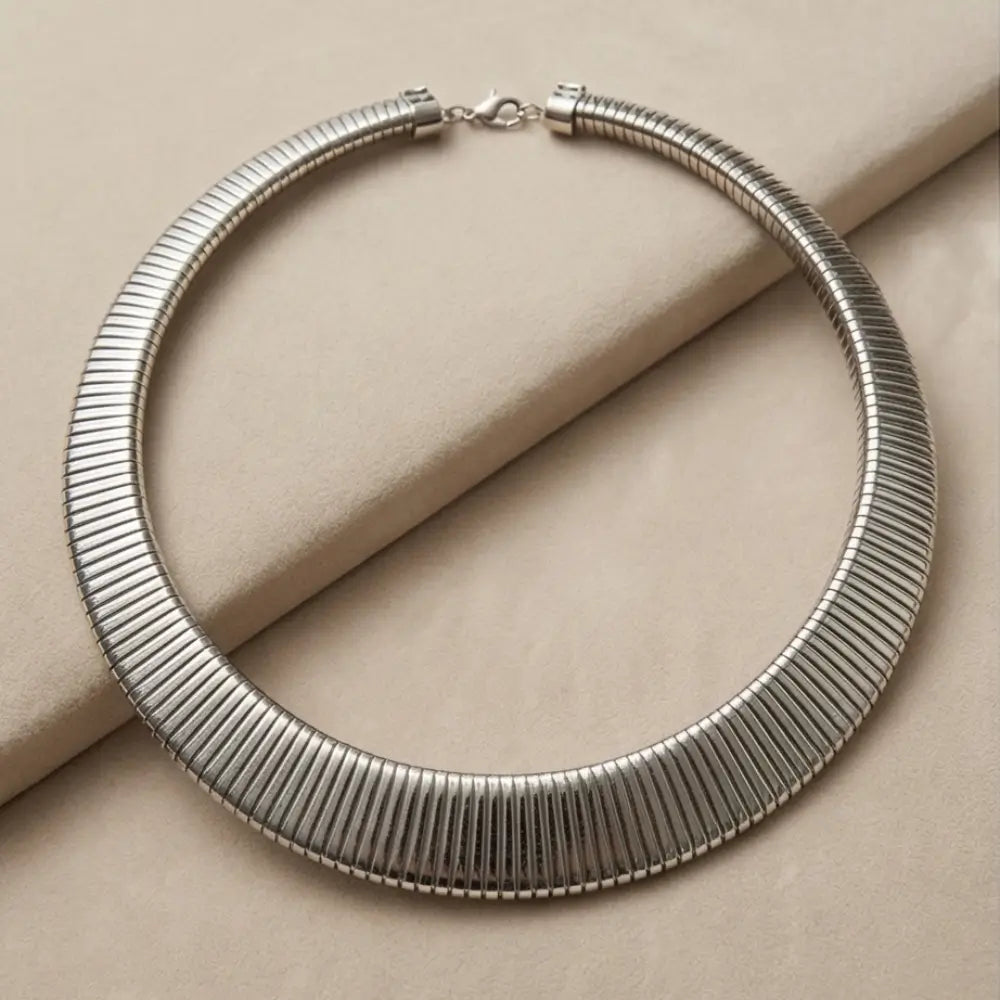 silver snake chain statement necklace minimalist choker jewelry on neutral background