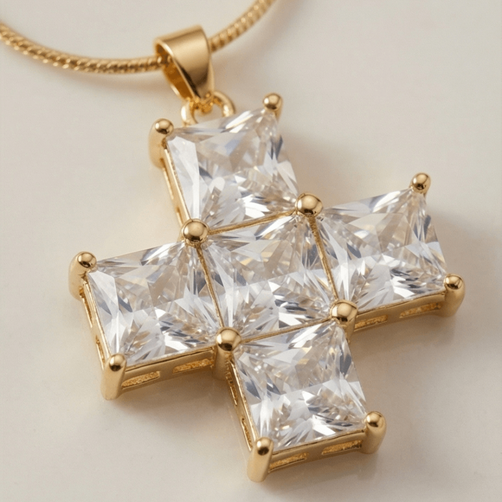 Gold necklace with a star-shaped pendant featuring clear gemstones on a light background