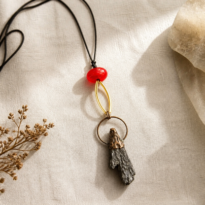 Terra adjustable long pendant necklace in red with copper-tone and dark sculptural handcrafted pendant