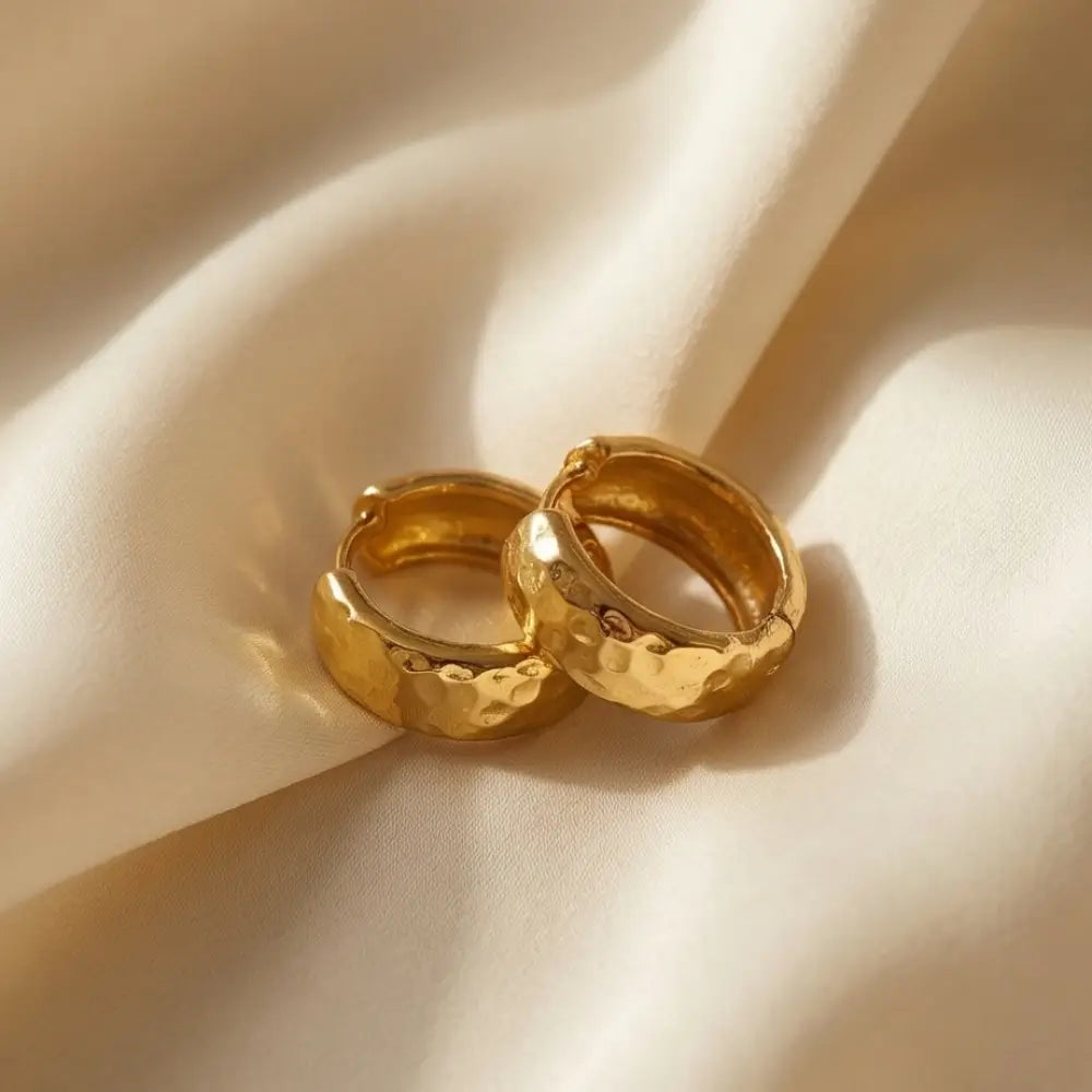 textured gold hoop earrings hammered finish minimalist jewelry flat lay
