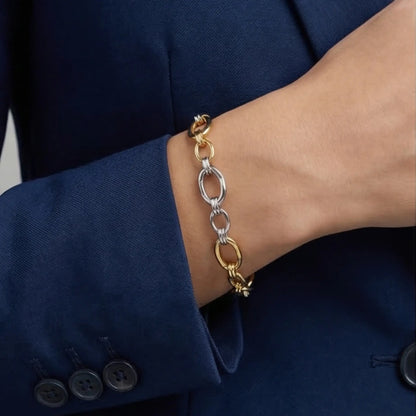 woman wearing two tone gold and silver chain bracelet modern jewelry Julie Saldivia