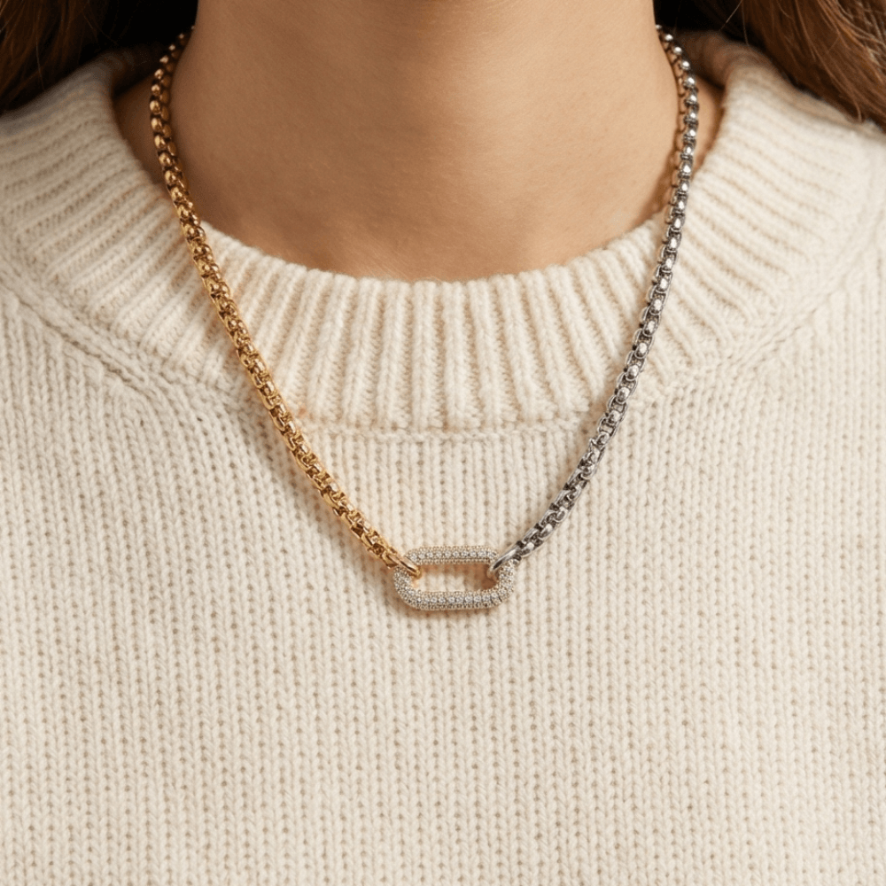 Woman wearing two-tone gold and silver chain necklace with pavé clasp everyday luxury jewelry styling