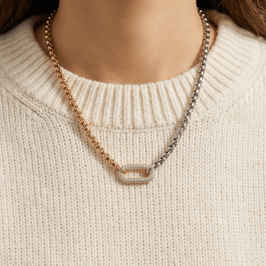 Woman wearing two-tone gold and silver chain necklace with pavé clasp everyday luxury jewelry styling